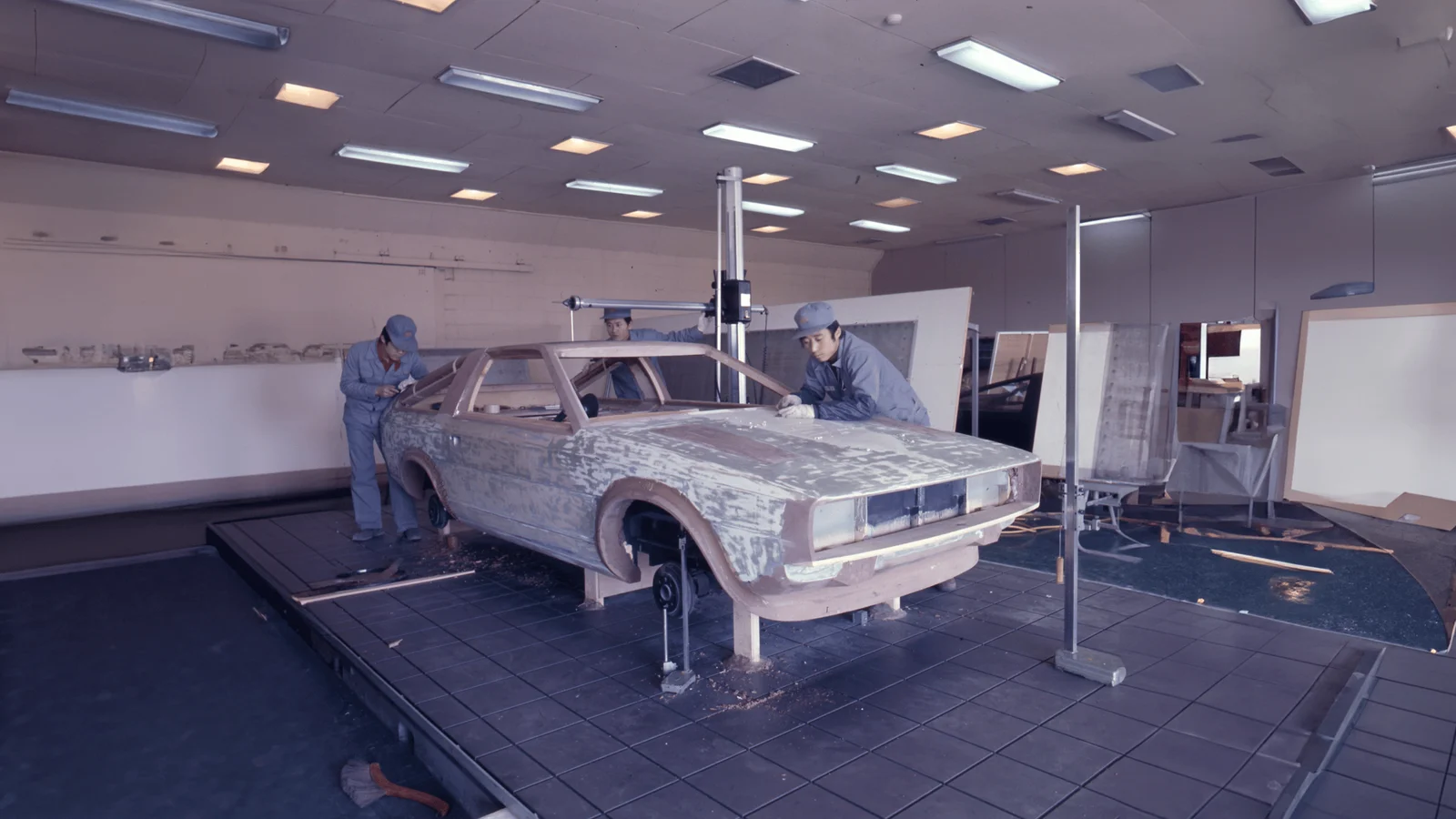 Engineers working on a Pony Coupe body at the Ulsan plant