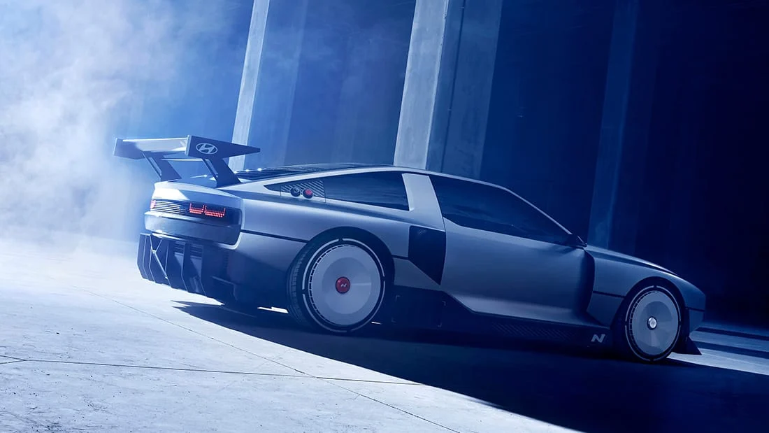Rear three-quarter view showing the N Vision 74 wing and side cooling intakes